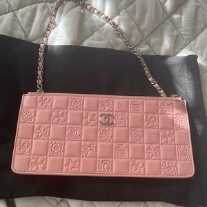 Chanel pink stamped leather pochette bag.